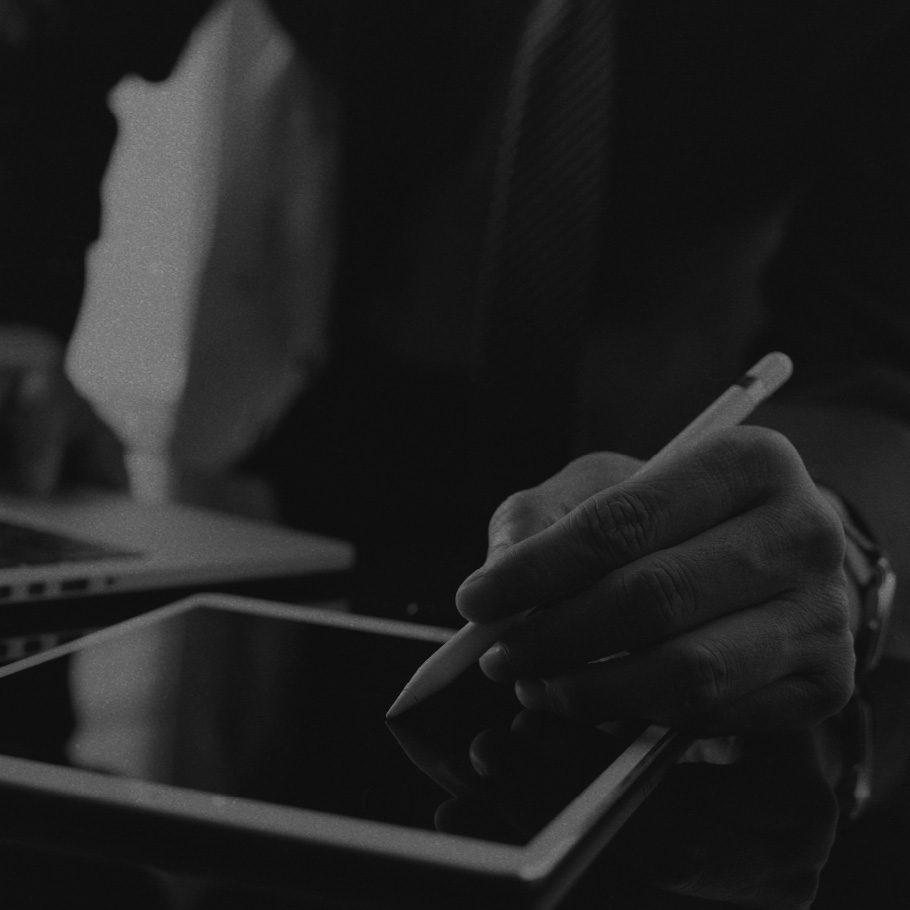 Man writing on a tablet.